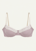 Front product view of the Lilac Charlotte Bra by Lunetti against an ivory background, featuring soft lilac bamboo jersey cups, delicate white lace trim, supportive underwire construction, and adjustable ivory shoulder straps.
