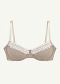 Front product view of the Stone Charlotte Bra by Lunetti against an ivory background, featuring soft taupe bamboo jersey cups, delicate white floral lace trim, supportive underwire construction, and adjustable ivory shoulder straps.