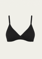 Black bamboo jersey Margot Bralette by Lunetti against an ivory background, featuring soft triangle cups, adjustable straps, and a wireless silhouette.