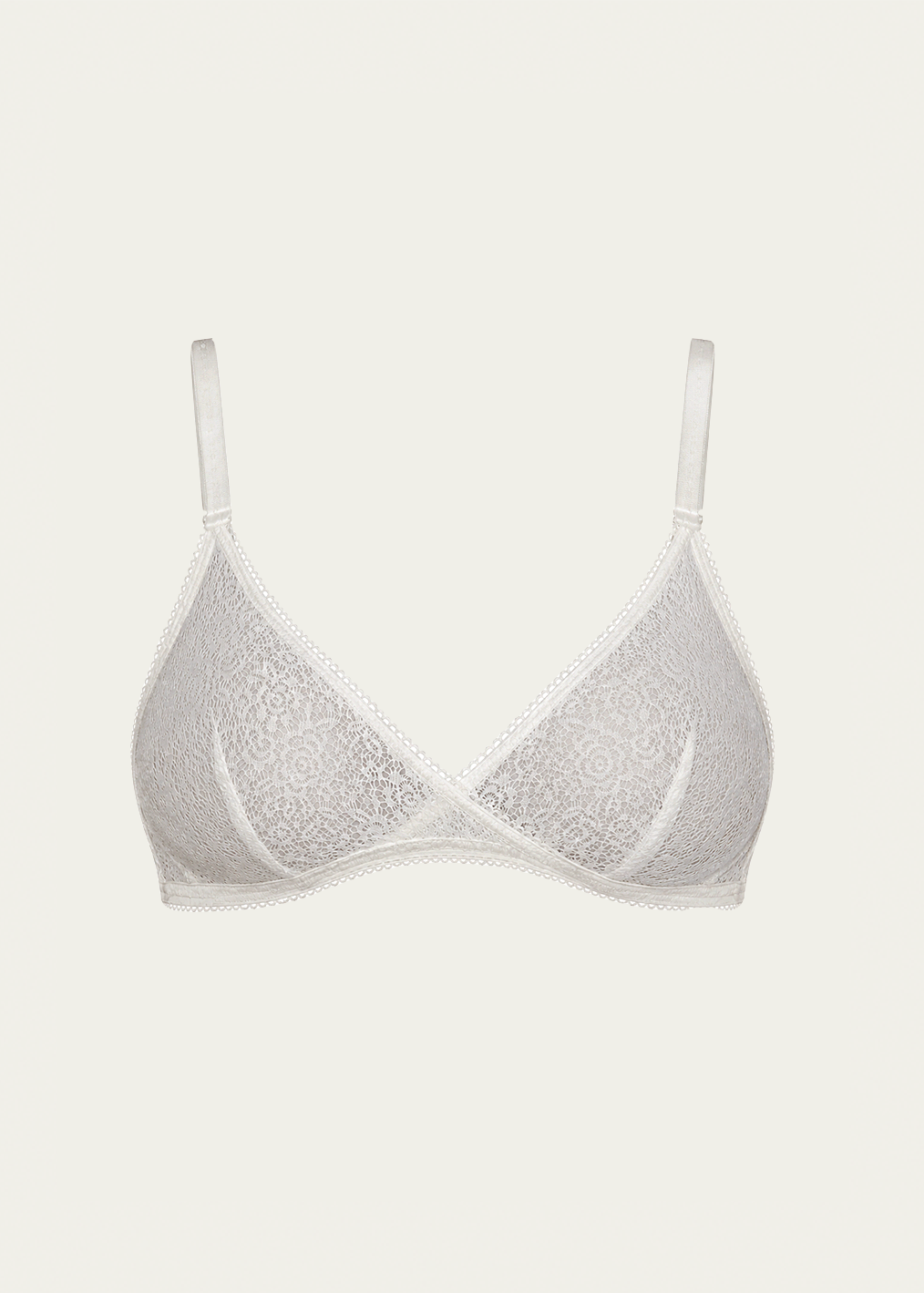 Salt white stretch lace Margot Bralette by Lunetti against an ivory background, featuring delicate floral lace, supportive criss-cross cup construction, and adjustable shoulder straps.