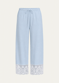 Coastal Blue Pima cotton Paloma Pant by Lunetti against an ivory background, featuring a relaxed wide-leg silhouette, adjustable drawstring waistband, and white cotton lace trim along the hems.