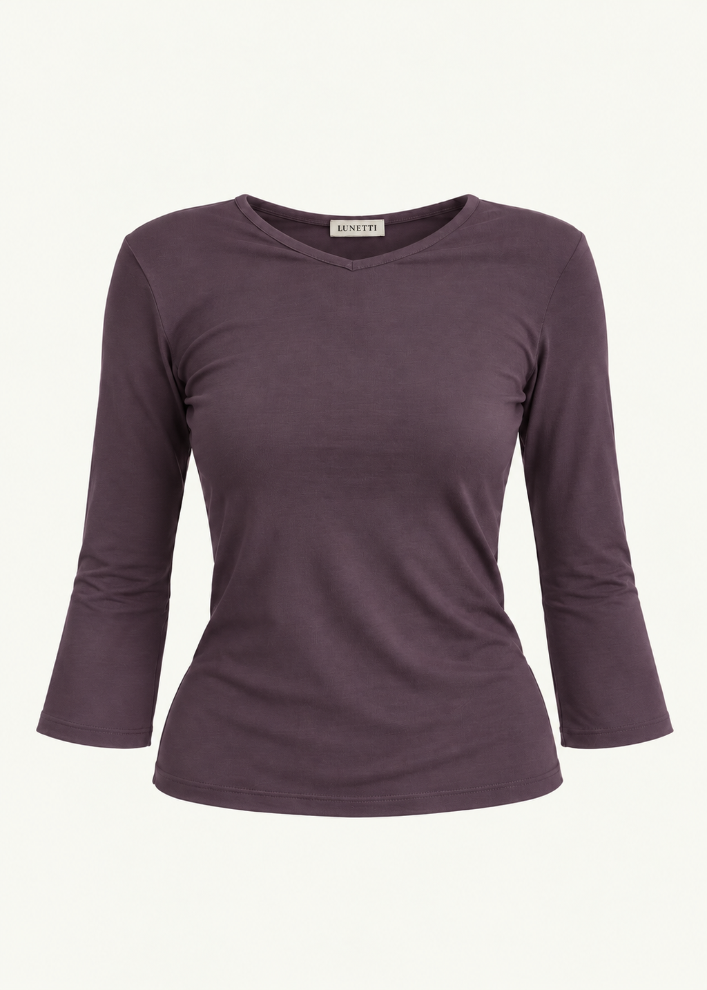 Front product view of the Amethyst Willow Top by Lunetti against an ivory background, featuring soft muted purple bamboo jersey, a V-neckline, fitted silhouette, gently flared three-quarter sleeves, and a signature Lunetti neck label.