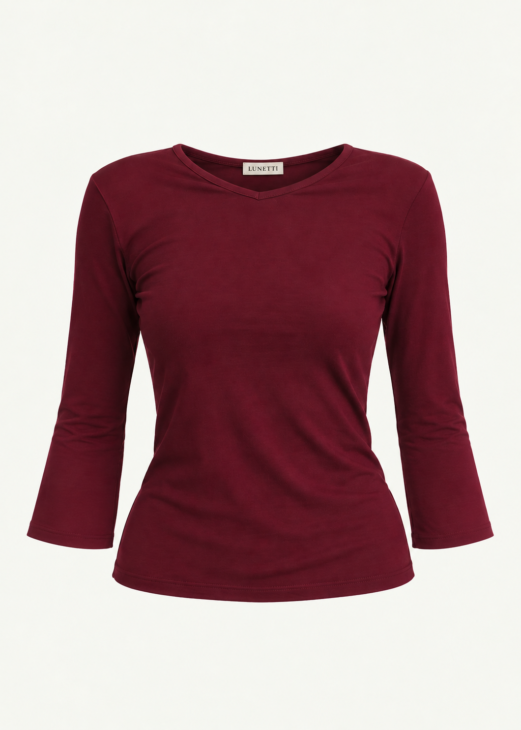Front product view of the Merlot Willow Top by Lunetti against an ivory background, featuring soft burgundy bamboo jersey, a V-neckline, fitted silhouette, gently flared three-quarter sleeves, and a signature Lunetti neck label.