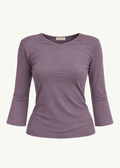 Front product view of the Orchid Willow Top by Lunetti against an ivory background, featuring soft lavender-purple bamboo jersey, a V-neckline, fitted silhouette, gently flared three-quarter sleeves, and a signature Lunetti neck label.