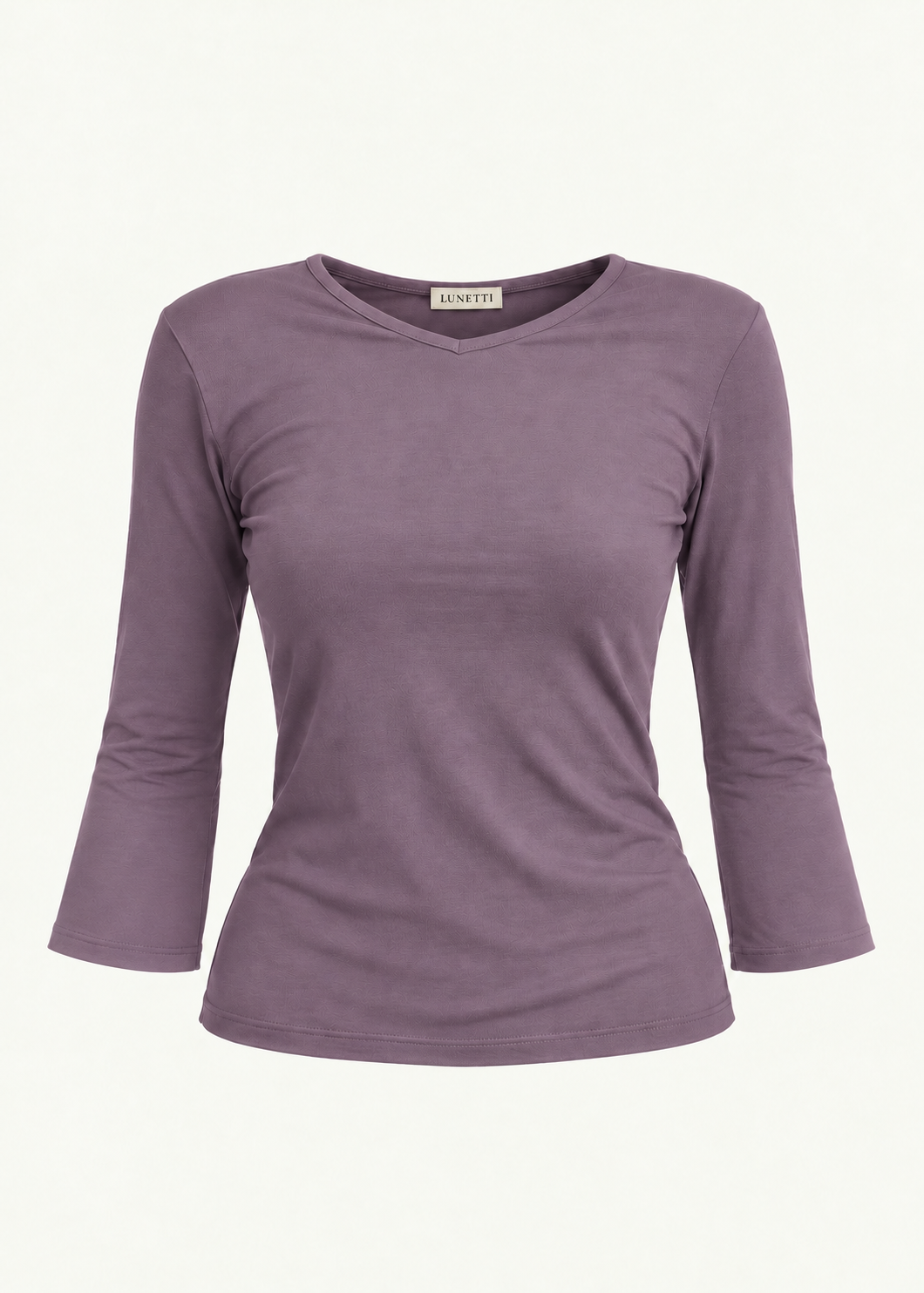 Front product view of the Orchid Willow Top by Lunetti against an ivory background, featuring soft lavender-purple bamboo jersey, a V-neckline, fitted silhouette, gently flared three-quarter sleeves, and a signature Lunetti neck label.