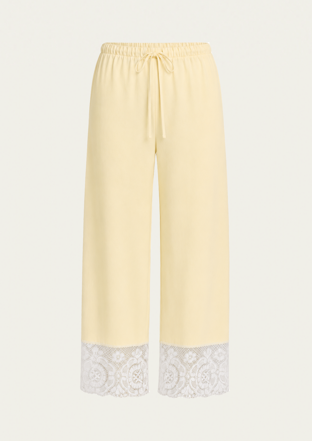 Light yellow wide-leg cropped pants with a white lace trim at the hem and a drawstring waist, shown on a plain light background.